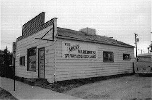The S. A. Club Cafe was a wood frame building with a gable roof and false façade. The foundation was a wood sill construction. It also had bevel wood siding covered with aluminium and plywood exterior siding. The roof was covered with roll asphalt.