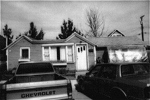The McPherson House is a small, one-storey frame house with U-shaped plan and a series of gable roofs.