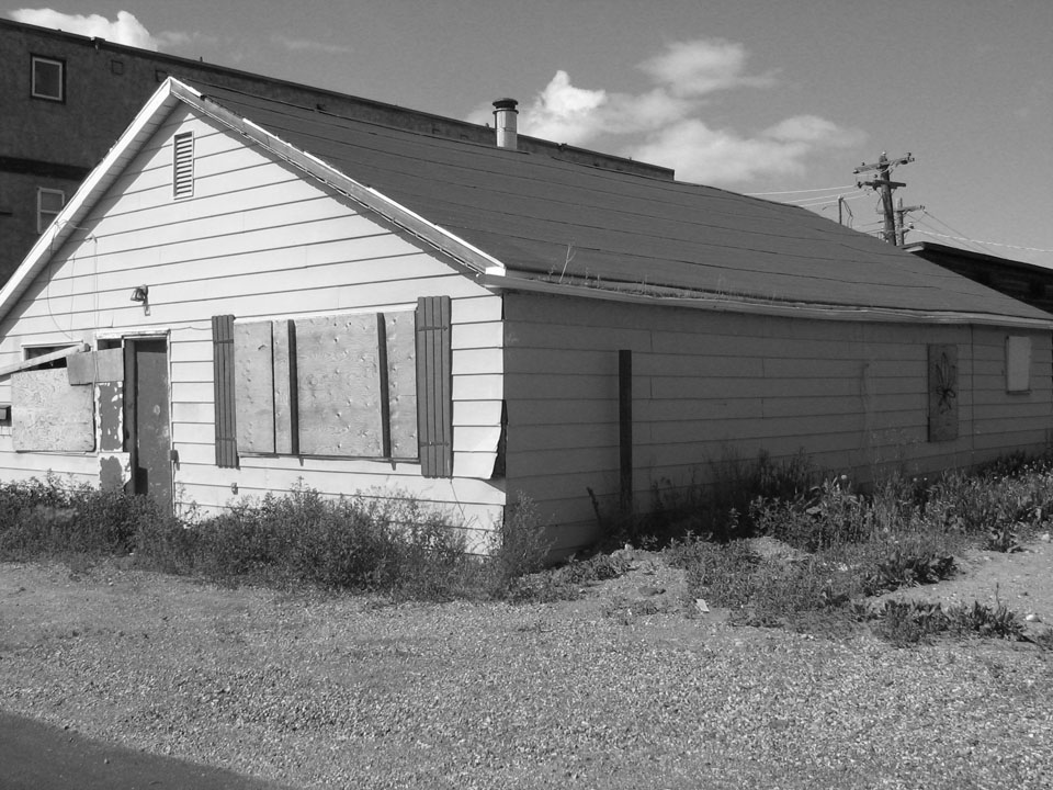 This image of Rosenburg House is a historical building with boarded windows